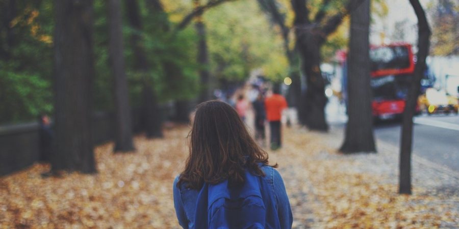 girl standing outside school worried about grades