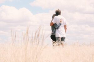 couple standing in field