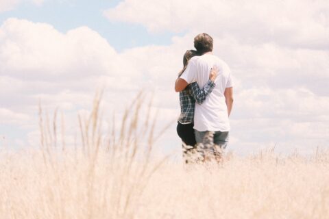 couple standing in field