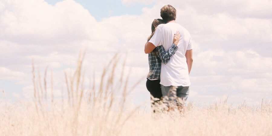 couple standing in field