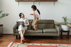 woman talking to her child about tips to organize her home and life